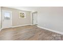 Bright bedroom features hardwood floors and neutral walls with ample natural light at 287 Young Sw Ave, Concord, NC 28025