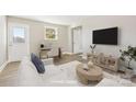 Bright living room with neutral tones, a workspace and modern furnishings at 287 Young Sw Ave, Concord, NC 28025