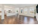 Bright, open-concept living room featuring hardwood floors and natural light at 833 River Park Rd, Belmont, NC 28012