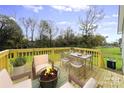 Relaxing deck with fire pit and seating area at 668 Bostian Rd, China Grove, NC 28023