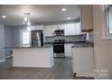 Modern kitchen with stainless steel appliances and an island at 31655 Pinewood Dr, New London, NC 28127