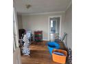 Living room with hardwood floors, neutral walls and doorway leading to another room needs updating at 50 Ranlo Ave, Gastonia, NC 28054
