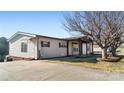 Beige ranch home with covered porch and spacious yard at 202 Mountain View Dr, Taylorsville, NC 28681