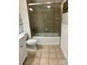 Well-kept bathroom showcases a tiled shower with glass doors and updated fixtures at 2518 Cranbrook Ln, Charlotte, NC 28207