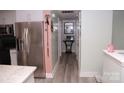 Bright hallway with wood-look flooring at 5824 Crossing King Dr, Charlotte, NC 28212