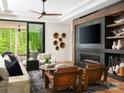Inviting living room features a fireplace, modern furniture, and a sliding glass door at 116 Hunt Camp Trl # 11, Davidson, NC 28036
