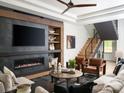 Comfortable living room with a fireplace, cozy seating, and natural light at 116 Hunt Camp Trl # 11, Davidson, NC 28036