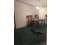 Bright dining room featuring a wooden table and four chairs at 5084 Beaver Dam Way, Bessemer City, NC 28016