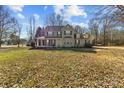 Two-story house with a large front yard covered in autumn leaves at 697 Maple Ridge Cir, Salisbury, NC 28147