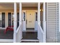 Front door entrance with a porch and red chairs at 697 Maple Ridge Cir, Salisbury, NC 28147