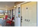 Front porch with two red chairs and a view of the yard at 697 Maple Ridge Cir, Salisbury, NC 28147