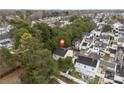 An aerial perspective of a home surrounded by lush greenery and a peaceful neighborhood at 8633 Sawleaf Ct, Charlotte, NC 28215