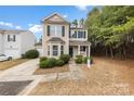 Two-story home showcasing traditional architecture, driveway, and an attached garage at 8633 Sawleaf Ct, Charlotte, NC 28215