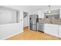 Kitchen boasting stainless steel appliances and white cabinetry at 9149 Washam Potts Rd, Cornelius, NC 28031