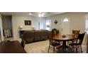 Open living and dining area with L-shaped sofa and wood table at 2544 Harmony Rd, Rock Hill, SC 29730