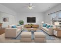 Spacious living room with neutral furniture and large TV at 2565 Meadow Crossing Dr, Dallas, NC 28034