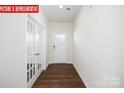 Bright entryway with hardwood floors and French doors leading to an office at 3721 Cullen Meadows Dr, Davidson, NC 28036