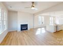 Bright living room with hardwood floors, fireplace, and an open floor plan at 9605 Pointer Rd # 78, Huntersville, NC 28078