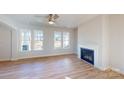 Inviting living room with fireplace, hardwood floors, and plenty of natural light at 9605 Pointer Rd # 78, Huntersville, NC 28078