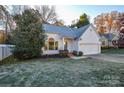 Charming single-story home with a well-manicured lawn, attached garage, and inviting curb appeal at 9709 Calpher Ct, Matthews, NC 28105