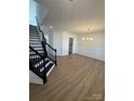 Bright dining room with hardwood floors and elegant chandelier at 11112 Lochmere Rd, Charlotte, NC 28278