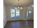 Bright dining room with hardwood floors and large windows at 11112 Lochmere Rd, Charlotte, NC 28278