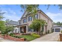 Brick home with a welcoming front porch and driveway at 1117 Churchill Commons Dr, Charlotte, NC 28211