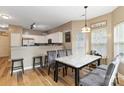 Inviting dining area with modern table, chairs, and adjacent open kitchen for easy entertaining at 4609 Emily Pl, Rock Hill, SC 29732