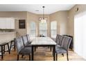 Spacious dining room with large windows offering natural light and elegant seating for Gathering at 4609 Emily Pl, Rock Hill, SC 29732