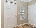 Welcoming entryway featuring a stylish wood floor, natural light, and modern decor at 4609 Emily Pl, Rock Hill, SC 29732