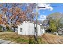 White exterior house with mature trees and a well-maintained yard at 105 Center St, Kings Mountain, NC 28086