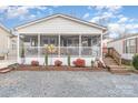 Single story home with screened porch and landscaped yard at 108 Elm St, New London, NC 28127