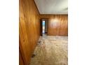 Spacious bedroom with wood paneling and carpet at 112 Adcock St, Belmont, NC 28012