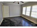 Simple bedroom with dark hardwood floors and multiple windows at 602 W Graham St, Shelby, NC 28150