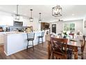 Well-designed kitchen with stainless steel appliances, sleek white cabinetry, and breakfast bar at 625 Charles St, Rockwell, NC 28138