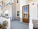 Inviting entryway with a wood door, modern hardware, and a covered porch perfect for relaxing at 8912 Connover Hall Ave, Charlotte, NC 28215