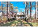 House exterior showcasing a front porch and landscaping at 917 Patrick Johnston Ln, Davidson, NC 28036