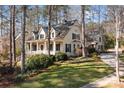 Charming home with inviting front porch, attached garage, and lush landscaping at 917 Patrick Johnston Ln, Davidson, NC 28036