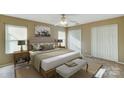 Bright bedroom with a queen-size bed and ample closet space at 9315 Ames Hollow Rd, Charlotte, NC 28216