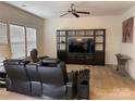 Living room with reclining chairs and entertainment center at 9514 Currier Rd, Charlotte, NC 28215