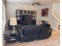 Living room with reclining chairs and entertainment center at 9514 Currier Rd, Charlotte, NC 28215