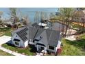 Aerial view showcasing the home's roof with solar panels, landscaping, and inviting entrance at 5056 Bridge Way, Denver, NC 28037