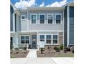 Charming two-story home showcasing a gray exterior, well-manicured landscaping, and a welcoming front porch at 5680 Clear Creek Ln, Charlotte, NC 28215
