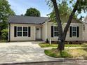 Well-maintained one-story home with a manicured lawn and inviting curb appeal at 702 Park Ave, Salisbury, NC 28144