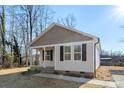 Newly built home with light beige vinyl siding and a covered front porch at 25 Kesler St, Salisbury, NC 28144