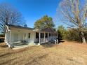 Front view of charming ranch home with covered porch and side carport at 3654 Lynwood Dr, Lancaster, SC 29720