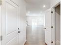 Bright entryway with hardwood floors leads to an open-concept living space at 4031 Lawnview Dr, Charlotte, NC 28269