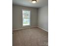 Cozy bedroom with neutral carpet, a large window and natural light at 718 Park Ave, Salisbury, NC 28144