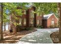 Two-story brick home with a curving driveway at 800 Lakeview Shores Loop, Mooresville, NC 28117