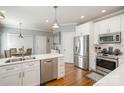 Bright kitchen with stainless steel appliances and white cabinets at 180 Sink Farm Rd, Mooresville, NC 28115